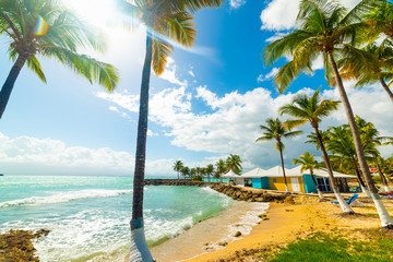 Sun shining over beautiful Bas du Fort beach in Guadeloupe