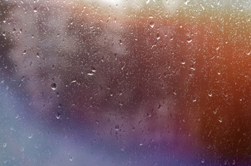 raindrops on the window. backlit background