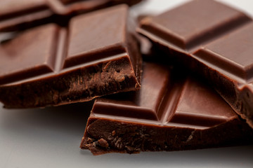 broken milk chocolate on a white background