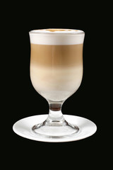 cappuccino in transparent glass on black background