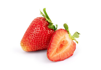 Whole and half strawberries on a white background
