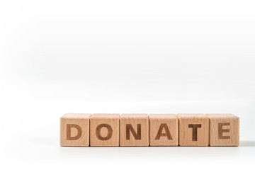 Donate wooden blocks of business concept isolated on white background.