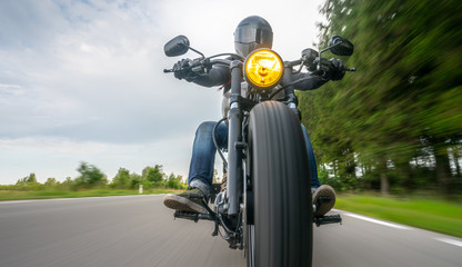 motorbike on the road riding. having fun riding the empty road on a motorcycle tour / journey