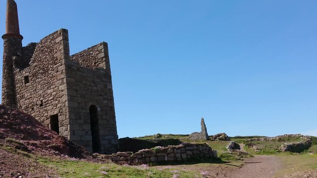 The Poldark famous tin and copper mine location known as wheal leisure. The real name is wheal owles, a world heritage site in the cornish countryside close to beautiful cliffs. Zoom out 4k footage