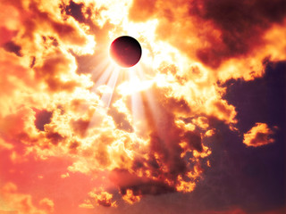 Solar eclipse, moon facing the sun. Sun rays passing through the clouds. Gods ray. It occurs when...