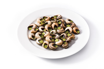 Escargots de Bourgogne on a plate isolated on white background