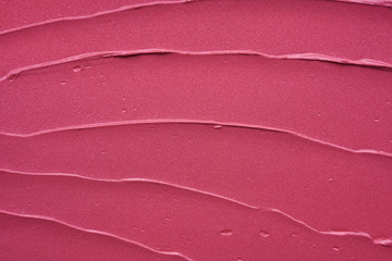 Gently pink strokes and texture of lip gloss