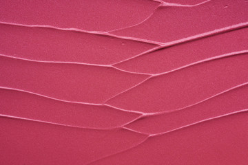 Gently pink strokes and texture of lip gloss