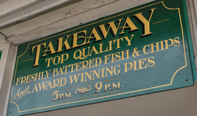 Traditional takeaway fish and chip shop sign