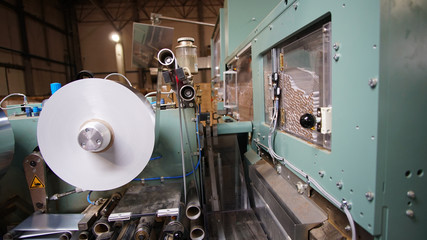 Small roll of paper for cigarettes packing