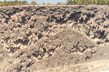 Cliffs at Wadi Dharbat near Salalah during the dry season, Oman.