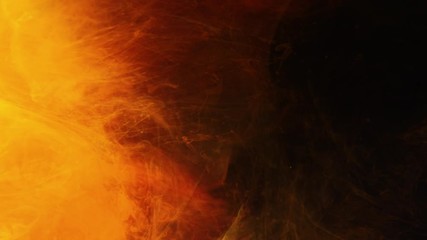 Solar flare and coronal mass ejection effect. Orange inks flowing in dark background. Light motion.