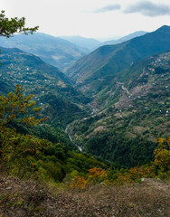 Fototapeta premium Amazing caucasus mountains of Khulo village, Adjara region, Georgia. View from Tago village. Colorful autumn season