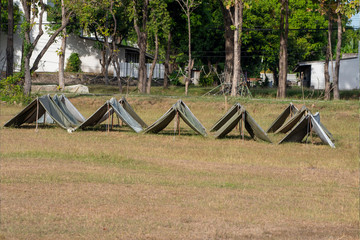 Scout tent in forest camp.