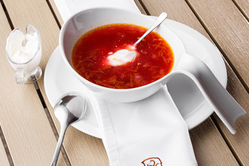 Top view Borscht, ukrainian cuisine sour soup, with meat, potato, beetroots. food background.