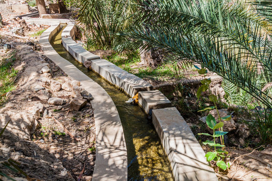 Traditional irrigation canal called Falaj in Wadi Tiwi valley, Oman