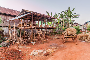 Barn and a wooden cart in a village in the area between Kalaw and Inle, Myanmar