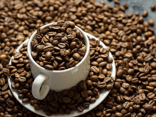 White coffee Cup filled with top quality roasted coffee beans