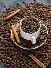 White coffee Cup filled with top quality roasted coffee beans