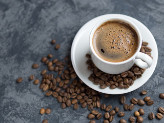 White Cup of espresso coffee with cinnamon on the copyspace concrete table