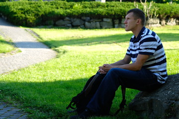 Portrait of young man in casual fashion clothes. Outdoor steet photo