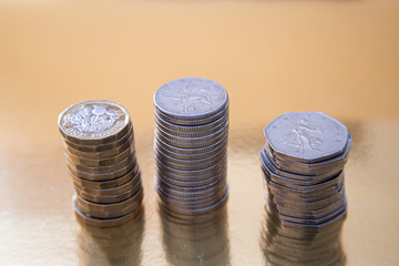 Three stacks of British coins