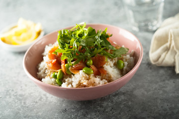 Healthy rice bowl with smoked salmon