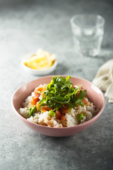 Healthy rice bowl with smoked salmon
