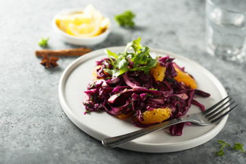 Fototapeta na wymiar Red cabbage salad with fresh orange