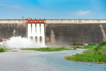 Amazing and beautiful water release at spillway or overflows at big dam with blue sky and cloud...
