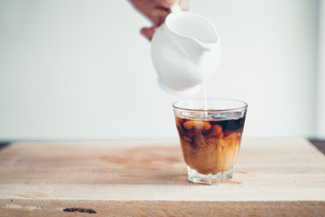 cold brew coffee Black coffee in a glass, add milk