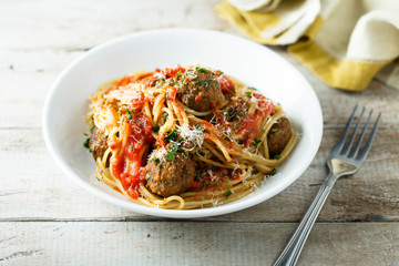 Homemade pasta with meatballs and tomato sauce