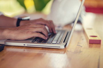 architect man working with laptop and blueprints,engineer inspection in workplace for architectural plan,sketching a construction project ,selective focus,Business concept vintage color