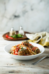 Homemade pasta with meatballs and tomato sauce