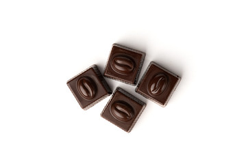 Four coffee sweets praline isolated on white background. Top view.