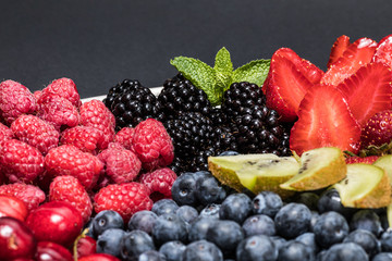 Mixed of color fruits. Sweet fruits and mixed berries.