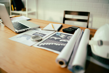 Architect workplace,pencil on blueprint and Circus.engineer inspective workshop,architectural project, blueprints,ruler,calculator,laptop and divider compass. Construction concept. Engineering tools.