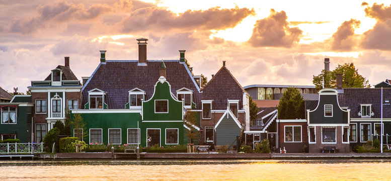Typically traditional Dutch architecture wooden houses, near water at the Zaanse Schans, Amsterdam