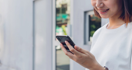 Asian women of happy smiling and using smartphone.The concept of using the phone is essential in everyday life.