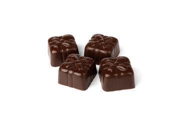 Chocolate sweets in heart shape isolated on white background.