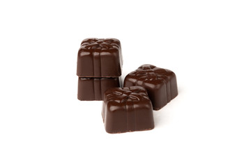 Chocolate sweets in heart shape isolated on white background.