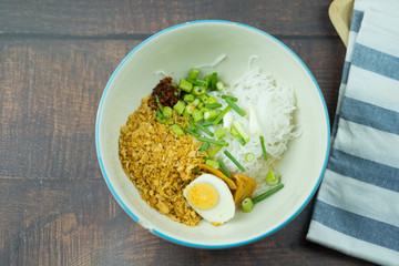 Salad rice noodles mix with spicy egg and vegetable