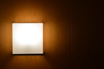 white light design on the wall with wood background
