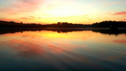 Fototapeta na wymiar Sunrise Over the Water