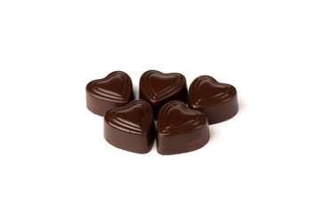Chocolate sweets in heart shape isolated on white background.