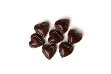 Chocolate sweets in heart shape isolated on white background.