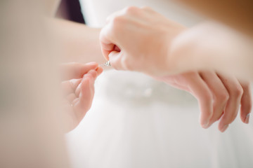 Bride white lace wedding dress. Bride help put on the wedding dress