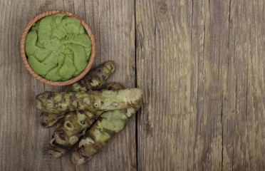 wasabi roots heap on wooden background