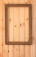 vintage photo frame on old wooden wall