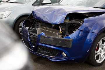 Fototapeta na wymiar Detail Of Car Damaged In Motor Vehicle Accident Parked In Garage Repair Shop